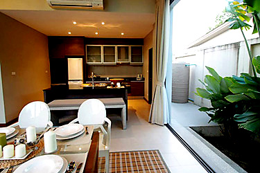 Living, Dining  and Kitchen Area with Garden and Pool View